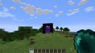 A player throwing an ender pearl toward a Nether portal. (Image via Mojang)